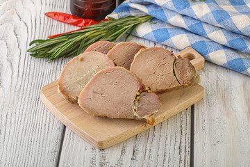 Baked pork tenderloin served rosemary