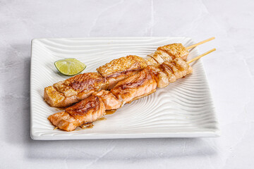 Grilled salmon skewer with sauce