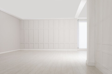 Empty room with beige walls and laminated flooring