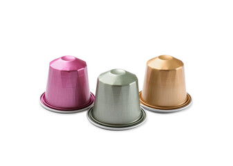 Three plastic coffee capsules isolated on white