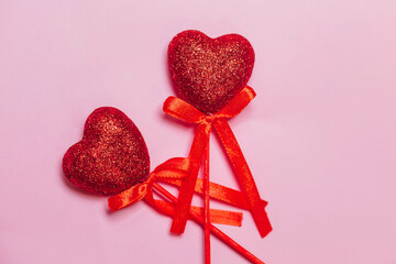 Two Wooden red heart shape isolated on pink background. Couple love concept