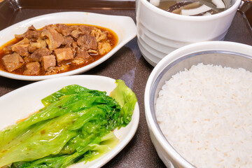 angle view five-spice beef brisket rice and coconut chicken soup with mushrooms at horizontal composition