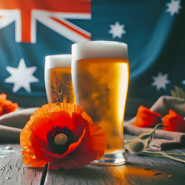 Two glasses of ice cold beer, poppy flowers and an Australian flag for ANZAC Day or Remembrance Day 