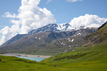 summer view Mont-Cenis lake massif at altitude of 1,974 m in commune of Val-Cenis in french Alps near Italy