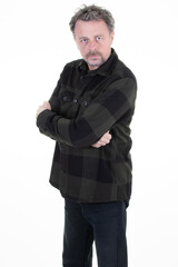 Handsome man middle aged bearded in plaid shirt checkered with folded arms crossed front of white background