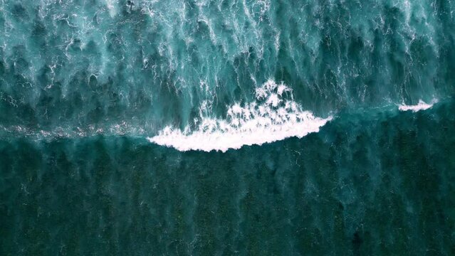 Beautiful quadcopter view of the dark blue waves. Aerial view of the dramatic ocean with beautiful waves.