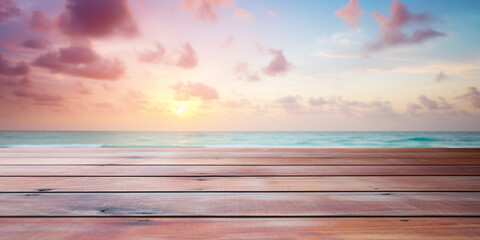 Fototapeta na wymiar Wooden planks with with blurry beach and ocean with pastel pink clouds in sky in background