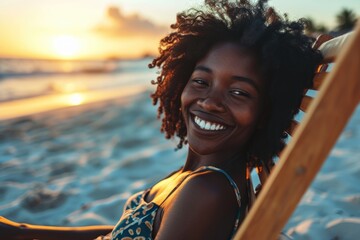 Happy African American woman sunbathing on tropical beach. Smiling girl enjoying vacation. - obrazy, fototapety, plakaty