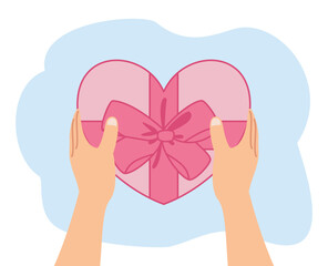 hand holding gift box shape heart for valentine day