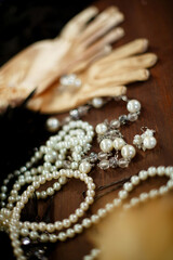white pearl jewelry on a wooden background