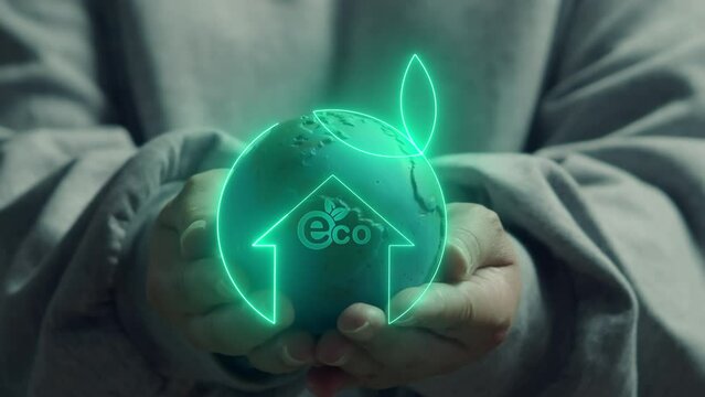 ECO or ecological, renewable energy and save environment concept. Human showing globe with neon green linear home with little leaf inside with ecology icon. Net zero greenhouse gas emissions target.