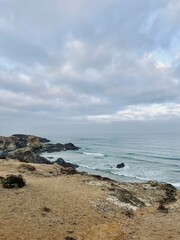 Fototapeta na wymiar Cloudy ocean view, rocky ocean coast, ocean bay