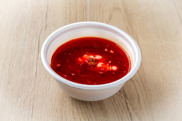 Borscht soup On a light wooden background.
