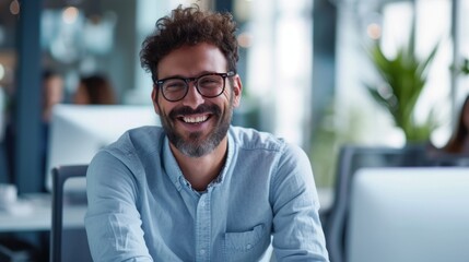 Portrait of Enthusiastic white man Working on Computer in a Modern Bright Office. Confident Human Resources Agent Smiling Happily While Collaborating Online with Colleagues  - obrazy, fototapety, plakaty