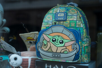 Naklejka premium Strasbourg - France - 27 January 2024 - Closeup of master Yoda bagpack in a toys store showroom