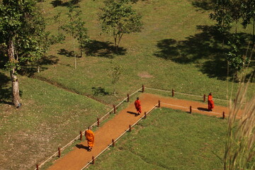 Monks walking on a pathway (Cambodia)