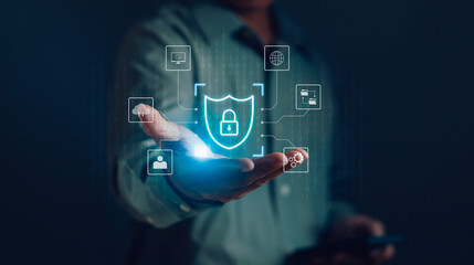 Man show protection of personal information Online transactions with padlock icon on hand to virtual graphics, cyber security concept, internet safe technology,Cyber security network