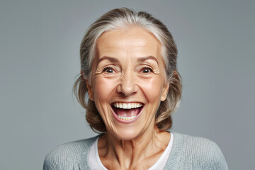 Portrait of senior female smiling woman looking at camera laughing - obrazy, fototapety, plakaty