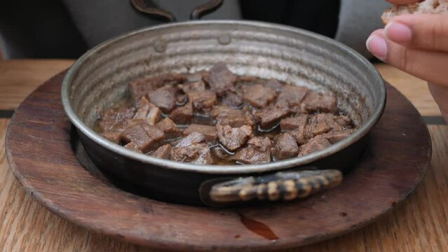 Turkish fried sausage sucuk in a pan