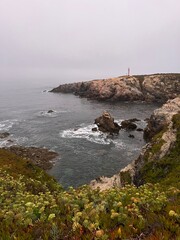 Lighthouse on the rocky coast of the ocean, ocean lighthouse, rocky coast