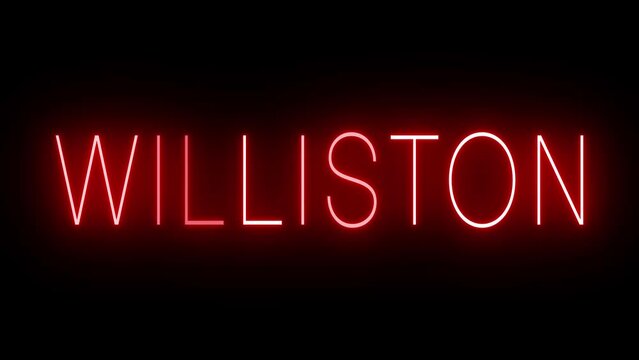Flickering red retro style neon sign glowing against a black background for WILLISTON