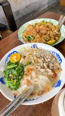 Kwetiau Kuah Pontianak, Kalimantan, Indonesia is a Chinese Indonesian flat rice noodle soup with garlic, onion ,beef, chicken, broth, prawn, crab and other vegetable.