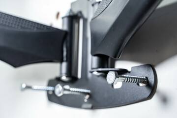 screws and TV wall mount base