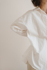 Young pretty woman in white linen shirt. Aesthetic minimal fashion concept