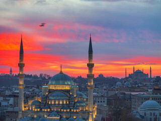 Fototapeta na wymiar New Mosque (Yeni Cami) and Hagia Sophia (Ayasofya) Mosque in the Magnificent Sunrise Colorful Drone Photo, Eminonu Fatih, Istanbul Turkiye (Turkey)