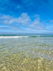 Transparent sea water, beautiful azure sea coast, sand beach, natural blue sea background
