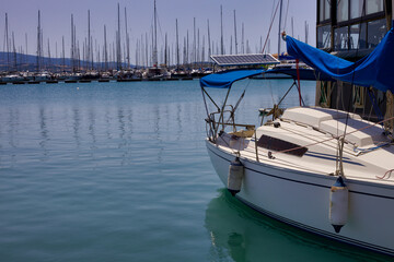 Small Boat at the harbour of Lefkada, a scenic view of the harbour with boats in the distance