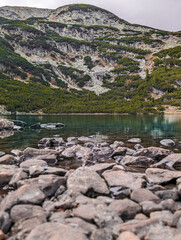 Fototapeta premium Scenic nature view of a mountain lake in the summer