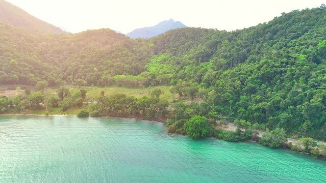 Surrounded by lush rainforests and crystal-clear turquoise waters, this paradise island is a breathtaking spectacle. Tourist attractions concept. Stock footage. Ko Chang, Trat Province, Thailand. 
