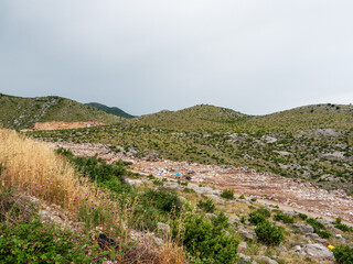 Landfill in mountains with dirt road