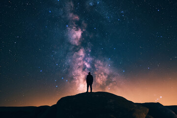 Silhouette of photographer with camera on top of mountain and milky way, Generative Ai