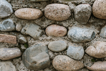 texture of a concrete wall with stones and cobblestones