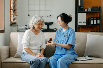 Asian Doctor and patient discussing something while sitting at the table . Medicine concept. ..