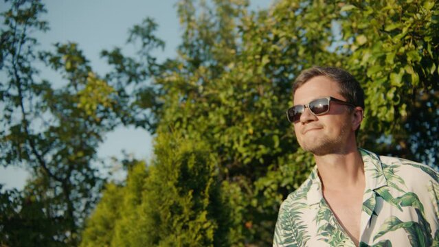 A man plays boules in the park