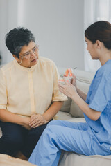 Woman dentist in dental office talking with Senior female patient and preparing for treatment. A dentist talking to Senior woman in dentist surgery, a dental check-up.