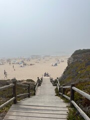 Foggy ocean coast, sea beach in the fog