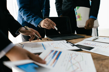 Corporate business people working in busy marketing office space, planning strategy in books and reading email on laptop at work, workers at startup advertising company