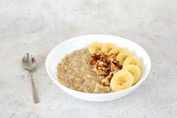 oatmeal with banana and walnut isolated close up 