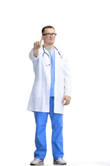 A male doctor, on a white background, in full height, shows a stop sign
