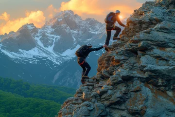 Foto op Canvas Two men climb a mountain peak during sunrise © Molostock