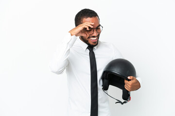Naklejka premium Young business latin man with a motorcycle helmet isolated on white background laughing