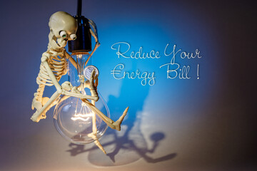 A funny and clever skeleton swinging on a light bulb, against a blue background, campaigns to save...