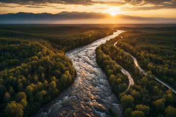 Elongated river flow winding in the middle of the forest at sunset seen from a high drone viewpoint - obrazy, fototapety, plakaty