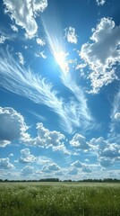 Obraz premium Blue sky and white clouds over a green field