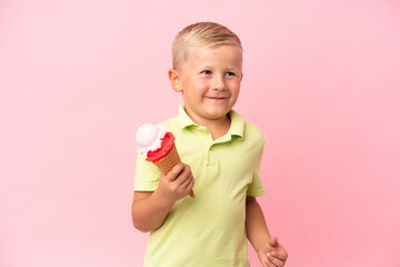 Little Russian boy with a cornet ice cream over isolated background