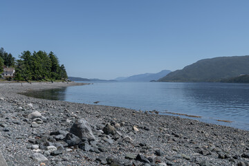 The Beach and a water front house in of Alert Bay, British Columbia, Canada